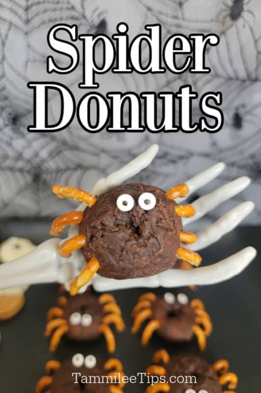 Spider Donut held by a skeleton hand under text of Spider Donuts