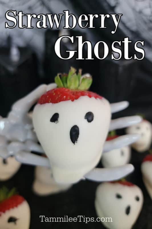 strawberry ghosts text over a white chocolate covered strawberry ghost on a skeleton hand