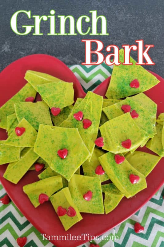 Grinch Bark text printed over a red heart plate with green grinch bark dessert on it. 