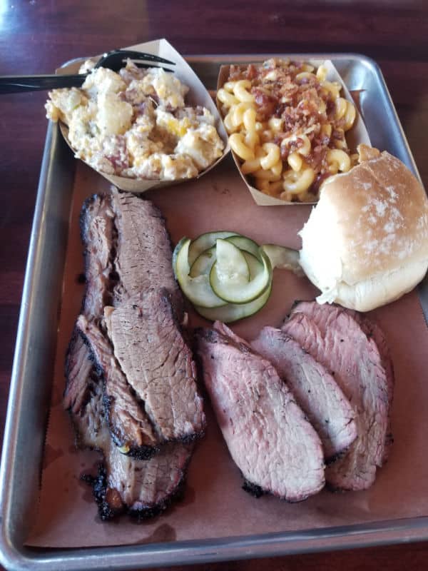 bbq platter with meat, mac and cheese, pickles and a roll at Smokehouse 41 Oakhurst