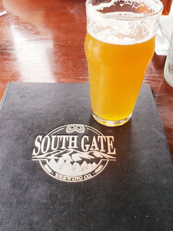 South Gate Brewing company logo with a glass of beer