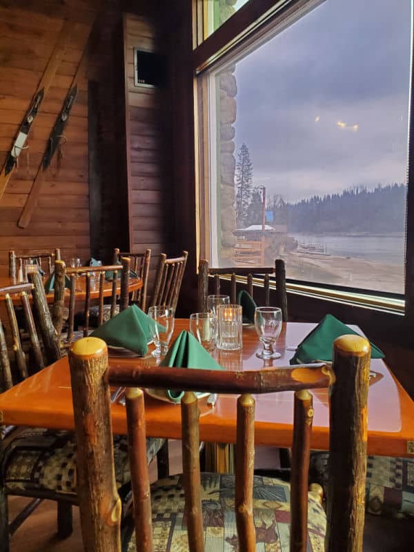 wooden chairs and table overlooking Bass lake at Ducys on the Lake Bass Lake