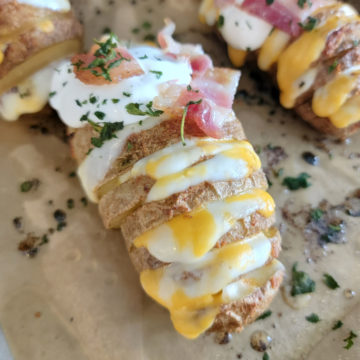 Hasselback Potato on parchment paper