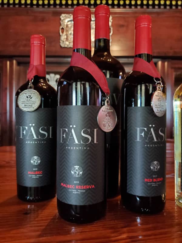 Fasi argentina albec Reserva, Malbec, and Red Blend wine bottles with awards on them. 
