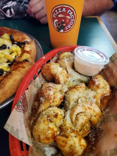 garlic bread twists in a red basket pizza factory oakhurst