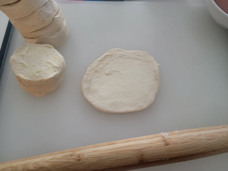 Refrigerator biscuit dough rolled out with a rolling pin