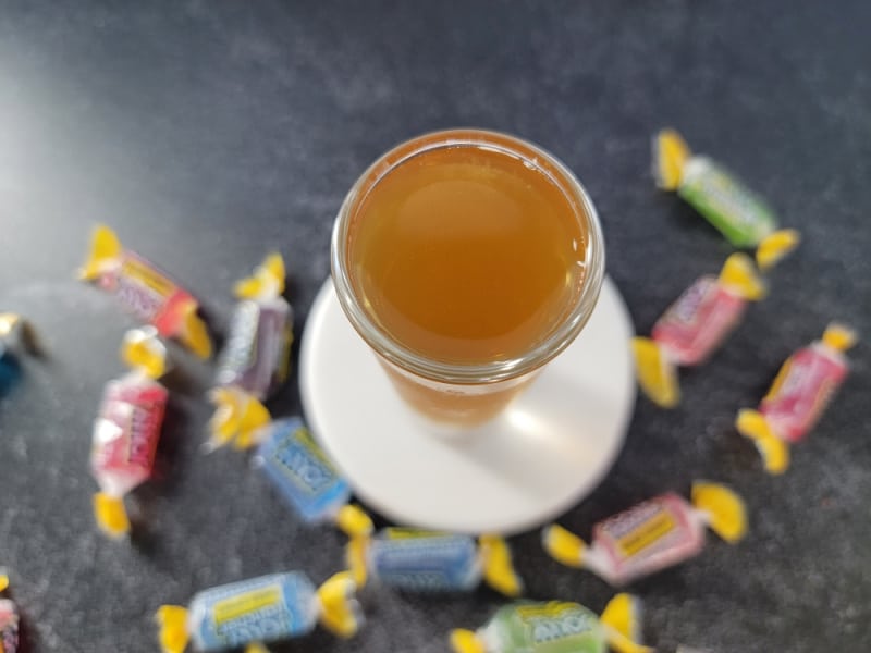 Looking down on a jolly rancher shot surrounded by jolly rancher candies