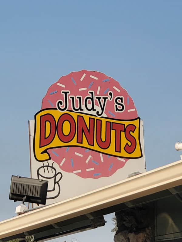 judys donut sign with pink donut oakhurst