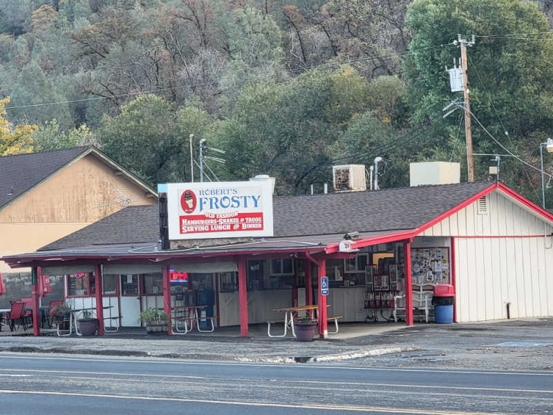 exterior building view of robert's frosty with trees in the background. 