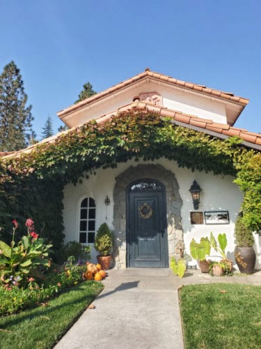 Exterior entrance covered in flowers at elderberry house oakhurst