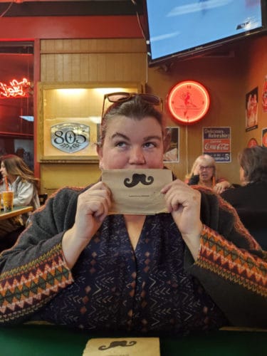 tammilee tips with mustache napkin pizza factory
