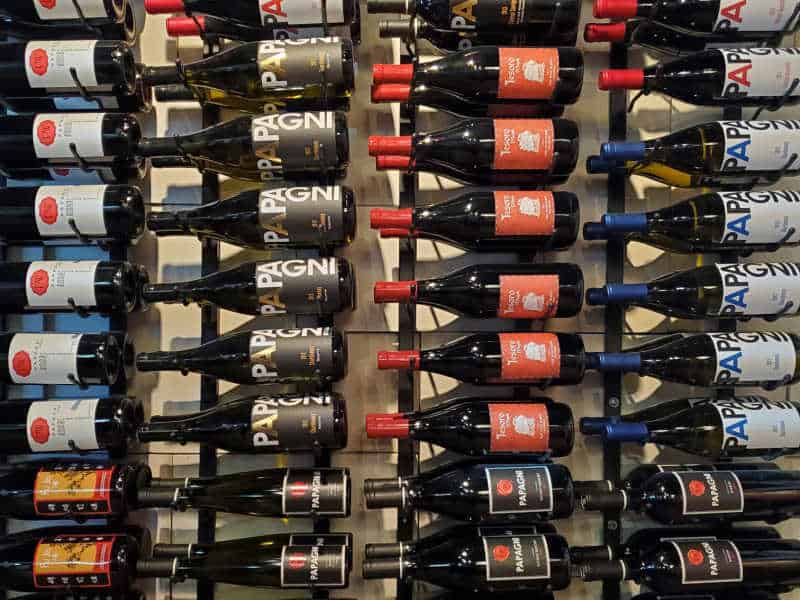 Papagni wine bottles on a rack
