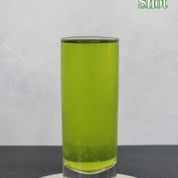 Broken Down Golf Cart Shot text above a green cocktail shot