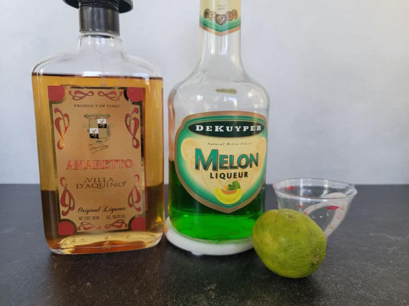 Broken Down Golf Cart Shot ingredients, amaretto, melon liqueur, and lime