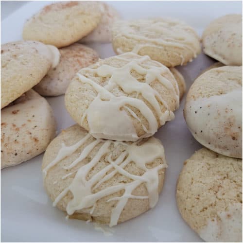 Eggnog cake mix cookies with icing on a white plate