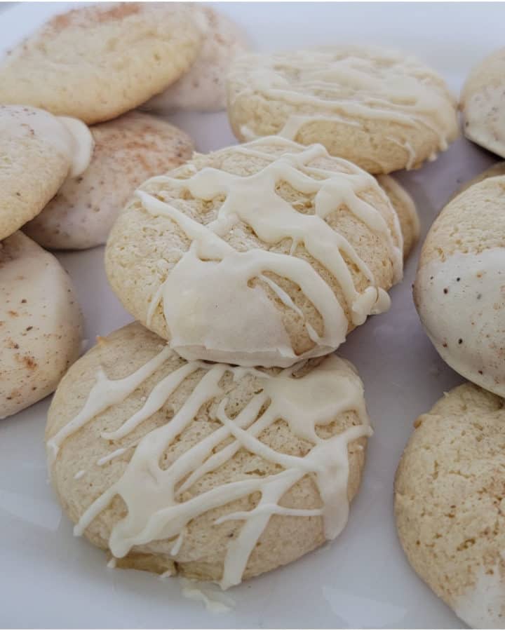 Eggnog cake mix cookies with icing on a white plate