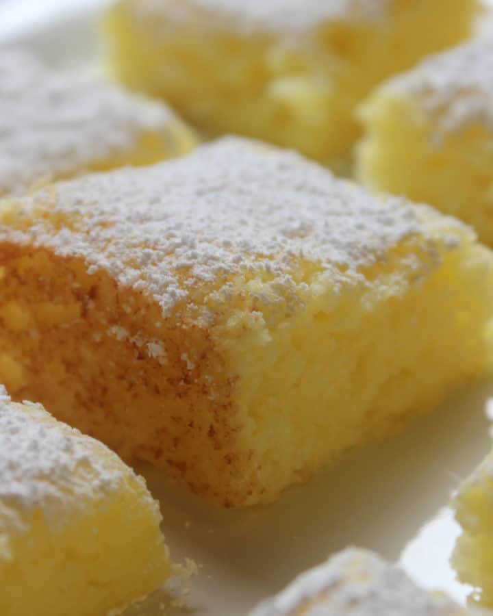 2 Ingredient Lemon Bars with powdered sugar garnish