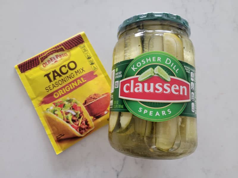 TikTok Taco Pickles Recipe Ingredients, taco seasoning and a jar of pickles