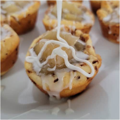 Icing drizzling onto a 2 Ingredient Cinnamon Roll Apple Pie Cups