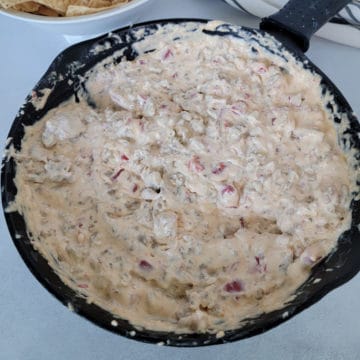 Rotel Sausage Dip in a cast iron skillet