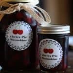 Mason Jars with a sticker saying Cherry Pie Moonshine