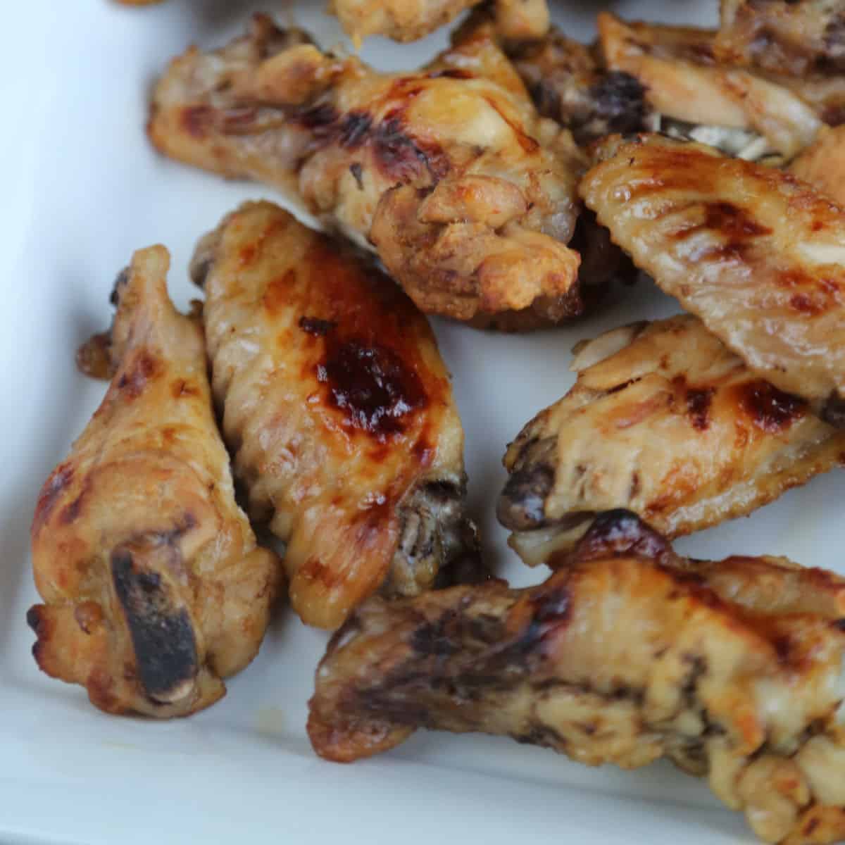 Mango Jerk Chicken Wings on a white platter