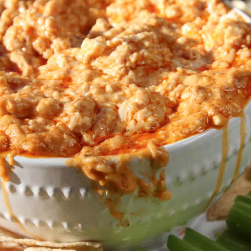 Crockpot Buffalo Chicken Dip in a white bowl with celery