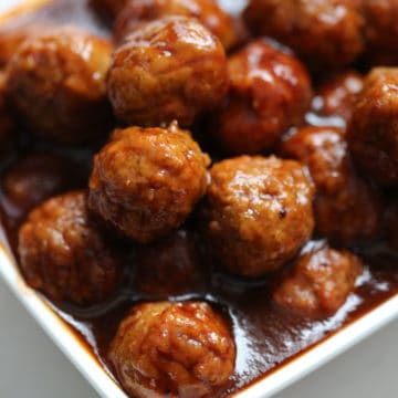 Cranberry Barbecue Meatballs piled in a white bowl