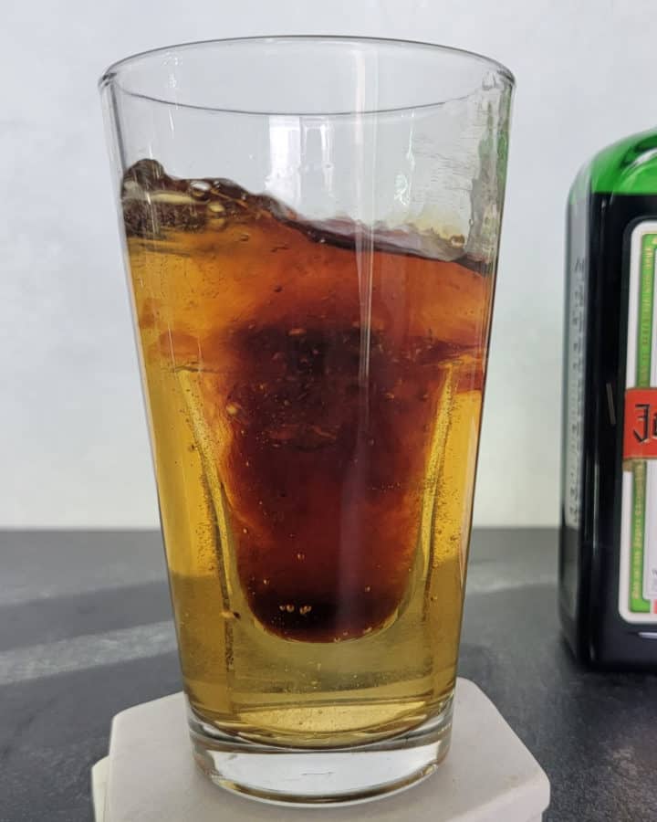 Jager Bomb Cocktail with the shot dropping into the glass