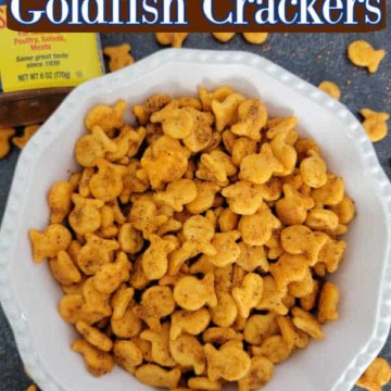 Old Bay Goldfish Crackers text printed over a large white bowl filled with Goldfish Crackers and a container of Old Bay Seasoning