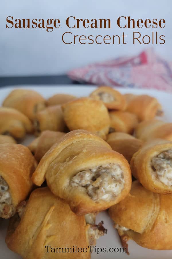 Sausage Cream Cheese Crescent Rolls text over a large plate filled with cream cheese sausage crescent rolls