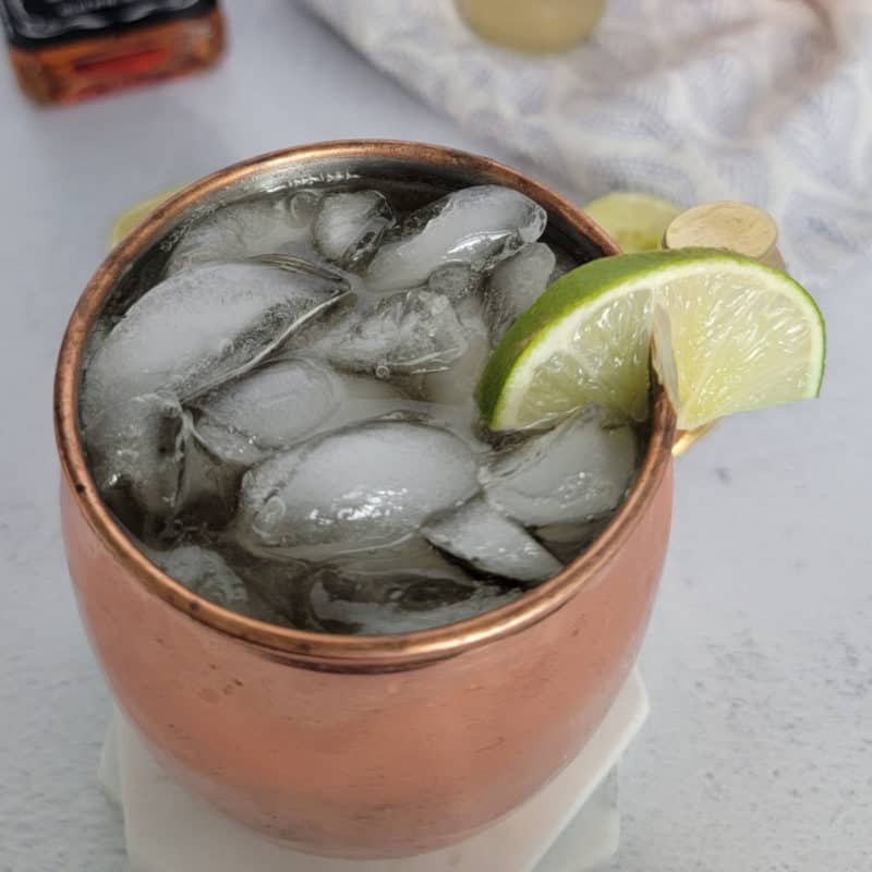 Whiskey Mule in a copper mug with lime wedge