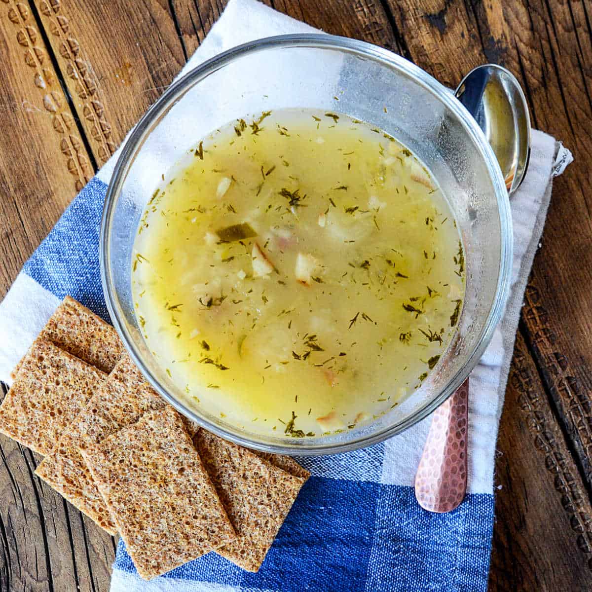 Crockpot Cabbage Roll Soup in a glass bowl next to crackers and a spoon