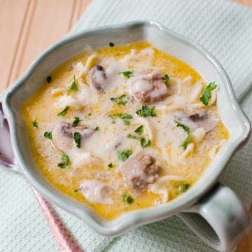 Crockpot Meatball Stroganoff Soup in a white bowl on a cloth napkin