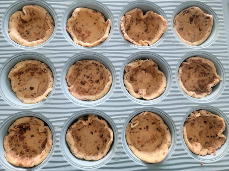 Cinnamon roll cups in a muffin tin