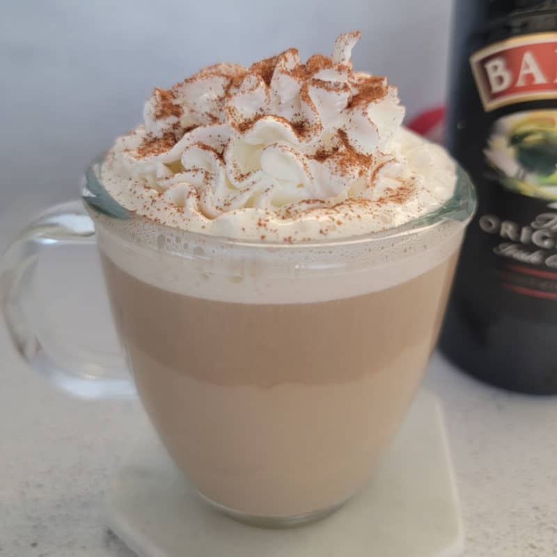 Bailey’s Coffee in a glass coffee mug garnished with whipped cream