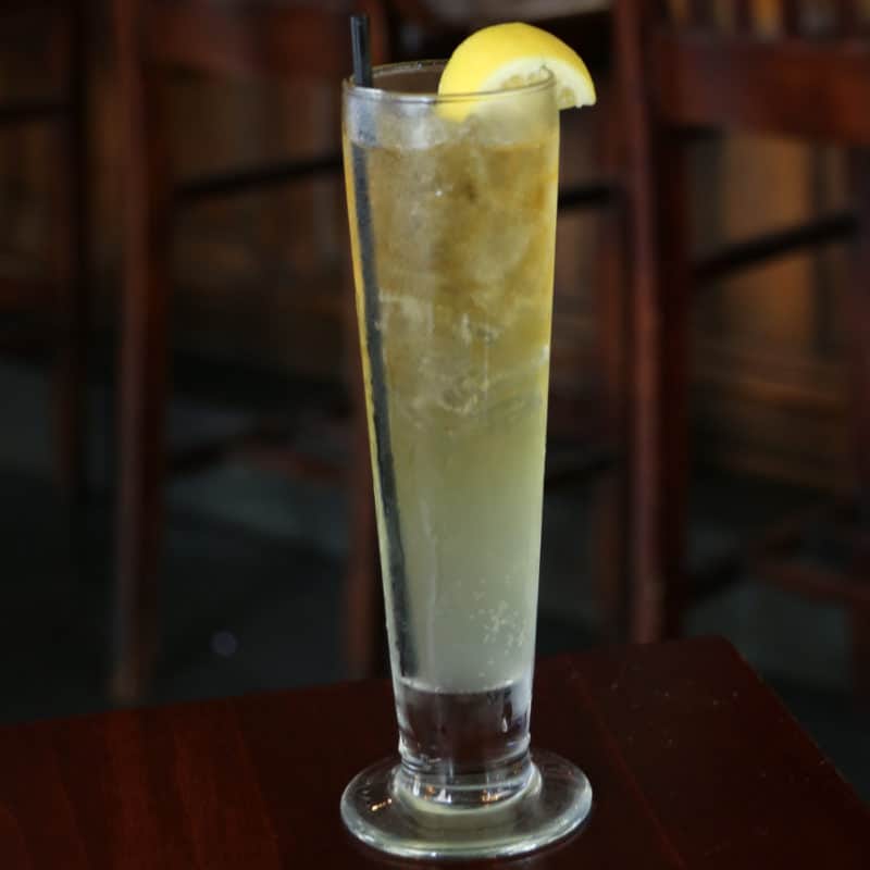 Lynchburg Lemonade in a tall glass with a lemon wheel
