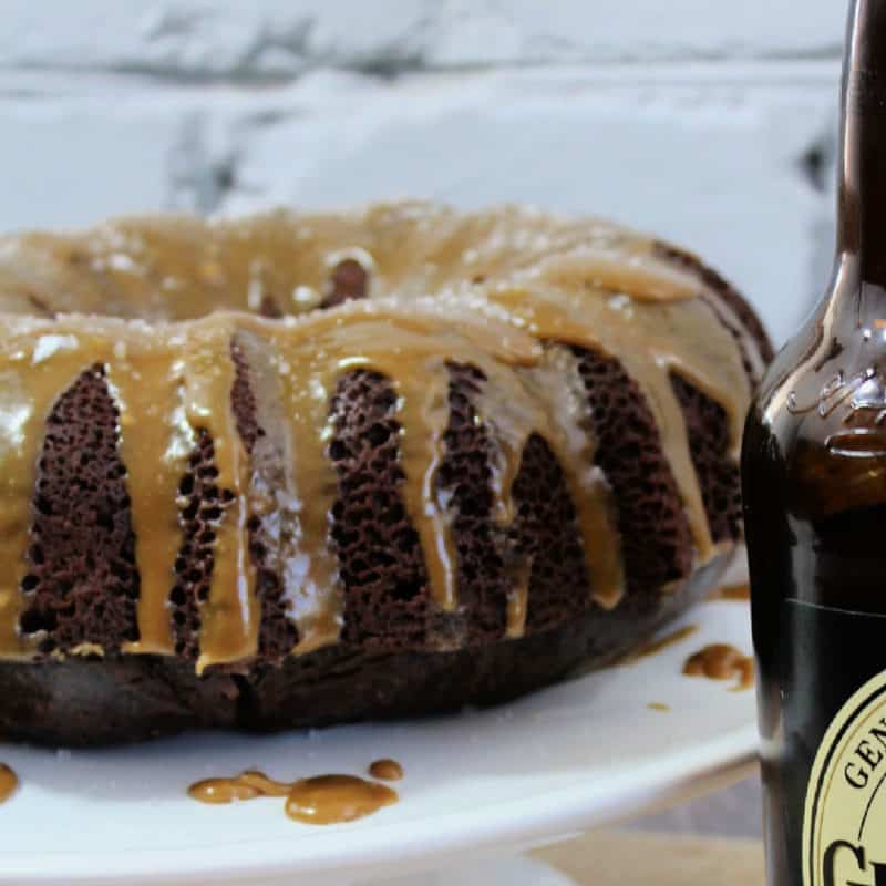 Guinness Chocoalte Cake with caramel icing on a white platter