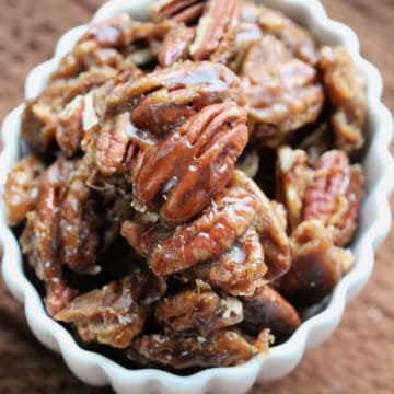 Guinness glazed pecans in a white bowl