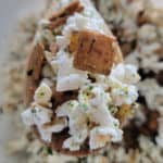 Hawaiian Hurricane Popcorn on a wooden spoon above the bowl