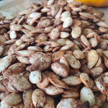 Pumpkin Spice Pumpkin Seeds on parchment paper