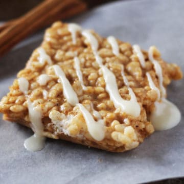 Pumpkin spice rice krispie square on a piece of parchment