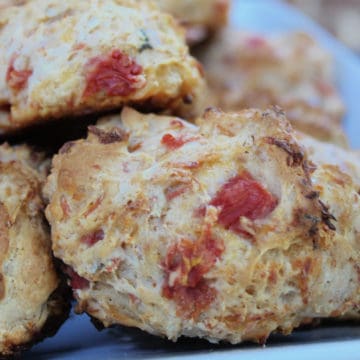 Spicy Southwest biscuits stacked on a white plate