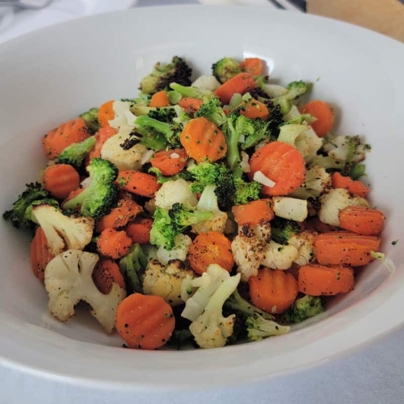 vegetable mix with cauliflower, broccoli and carrots in a white bowl