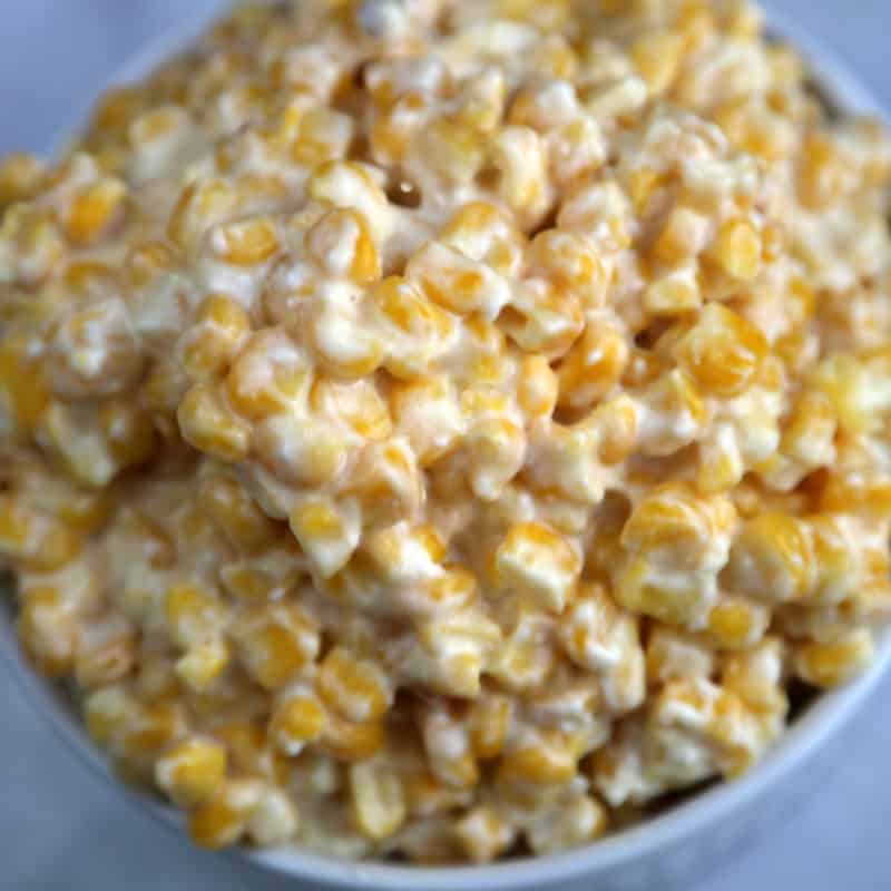 creamed corn in a white bowl