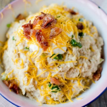 mashed cauliflower topped with cheddar cheese and bacon