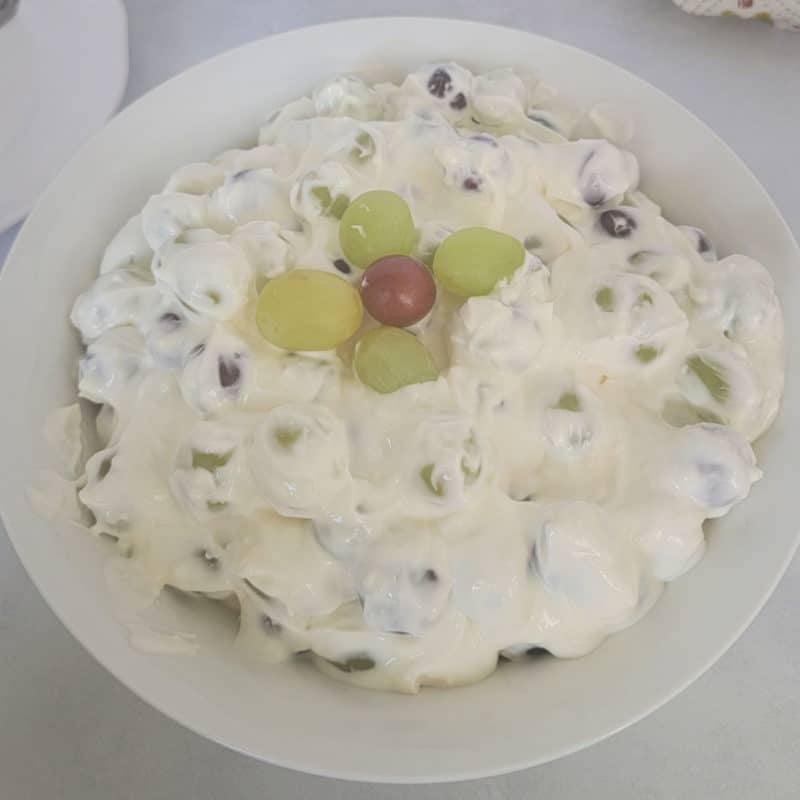 Grape salad with green and red grapes in a white bowl