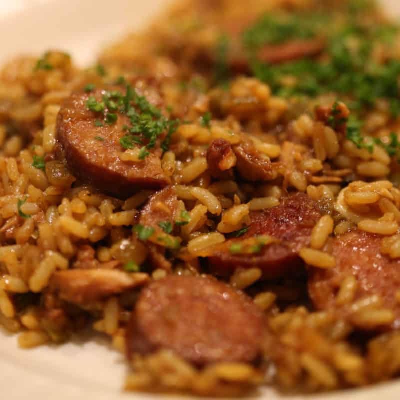 Jambalaya and rice on a white plate