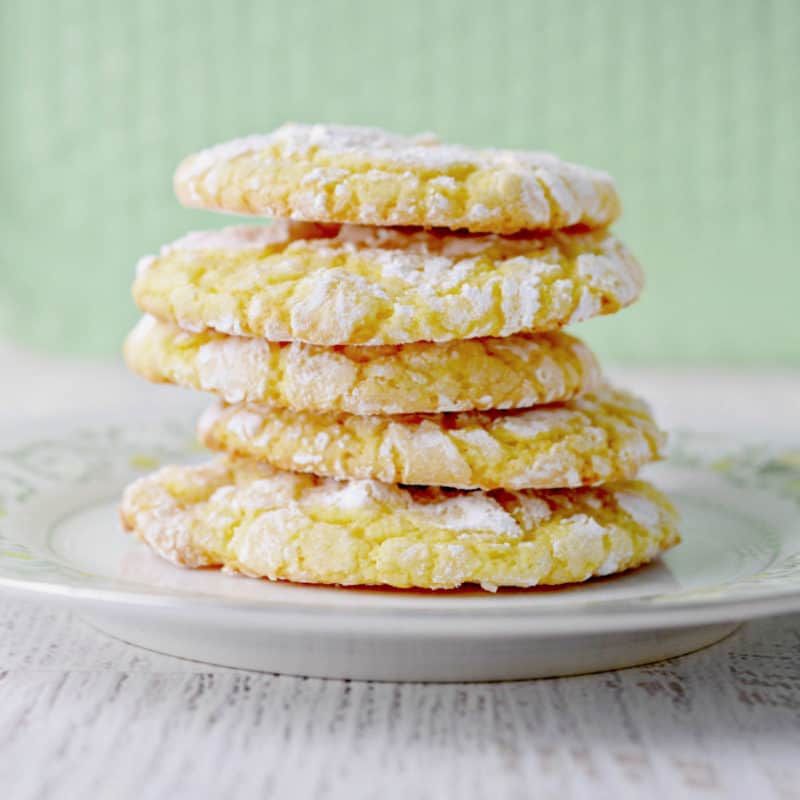 Stack of lemon cake mix cookies on a white plate