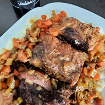 Port braised short ribs on a white platter